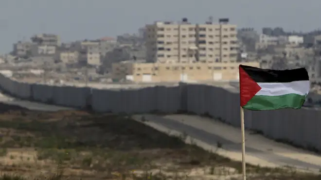 A Palestinian flag flying near the southern Gaza Strip town of Rafah