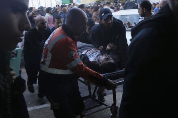 Palestinians wounded in the Israeli bombardment of the Gaza Strip are brought to the hospital in Deir al Balah, Gaza Strip, on Sunday, December 24, 2023. 