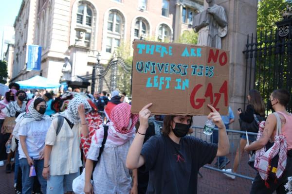 Pro-Palestine protestors demonstrate as Columbia University students line up to enter campus on the first day of classes for the fall semester on Tuesday, September 3, 2024.