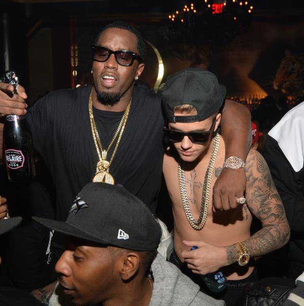 Sean 'Diddy' Combs and Justin Bieber attend the Ciroc party at Vanquish Lounge on February 5, 2014 in Atlanta, Georgia.